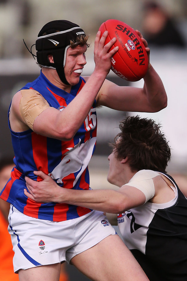TAC Cup Semi Final - North Ballarat v Oakleigh Chargers MELBOURNE, AUSTRALIA - SEPTEMBER 19: Sam McLarty of the Chargers withstands a tackle during the 2015 TAC Cup Semi Final match between the North Ballarat Rebels and the Oakleigh Chargers at Ikon Park, Melbourne, Australia on September 19, 2015. (Photo by Michael Dodge/AFL Media)